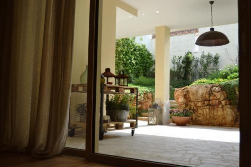 a room with a door open to a patio at A CASA DA LISA (exclusive room) in Turi