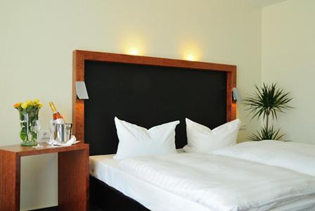 Postel nebo postele na pokoji v ubytování Hotel Prinzen