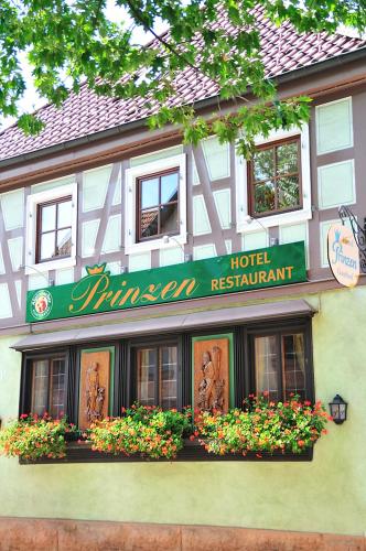 a hotel with flowers in front of a building at Hotel Prinzen in Kappelrodeck