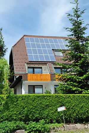 a house with solar panels on top of it at Hotel Prinzen in Kappelrodeck