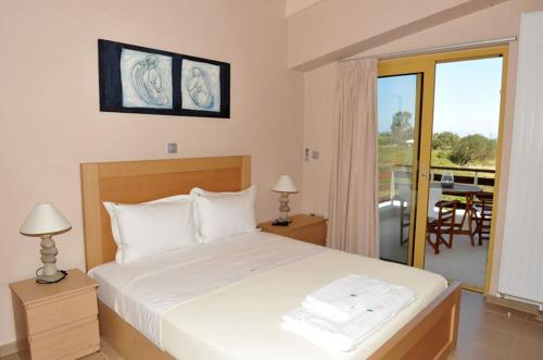 Postel nebo postele na pokoji v ubytování Casa Smaragdi Villas