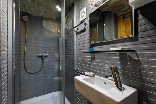 a bathroom with a sink and a shower at Villa Marta in Split