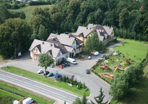 an aerial view of a large house on a street at Zajazd Pod Lipą in Humniska