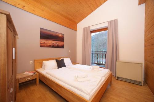 Ένα ή περισσότερα κρεβάτια σε δωμάτιο στο Chalet an der Schmittenhöhe