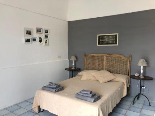a bedroom with a bed with towels on it at Casa Carmela in Ponza