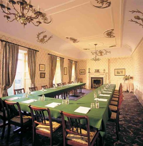 a large room with a long table and chairs at Ghan House in Carlingford