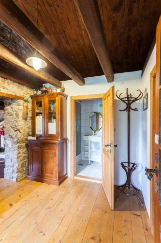 an open hallway with a wooden floor and a mirror at Summerhouse Beram in Pazin