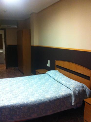 Postel nebo postele na pokoji v ubytování Hotel Manises