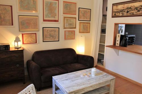 a living room with a couch and a coffee table at The Back Street Nest in Lisbon