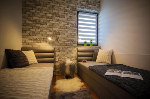 Apartament Premium 608-593-000 tesisinde bir odada yatak veya yataklar