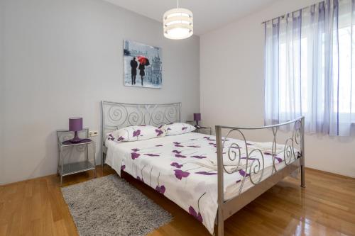 Ένα ή περισσότερα κρεβάτια σε δωμάτιο στο Beachfront Apartments Gabine
