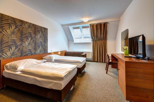 Säng eller sängar i ett rum på Hotel Iberia