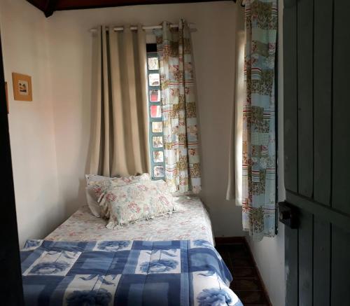 Un pat sau paturi într-o cameră la Pousada Maria da Toca