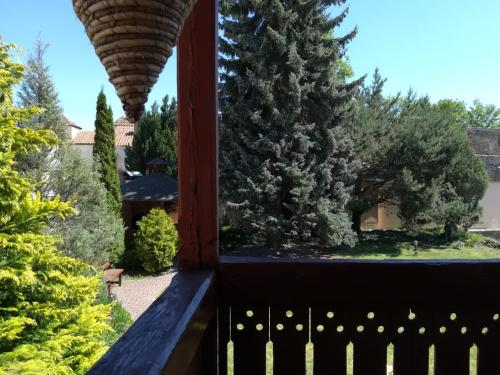a view from the balcony of a house with trees at Penzión Rodina in Levoča