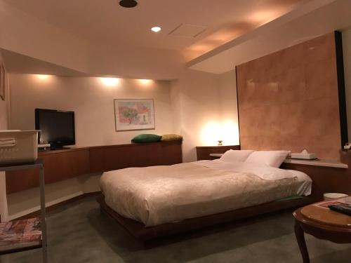 Ένα ή περισσότερα κρεβάτια σε δωμάτιο στο Hotel Tiffany (Adult Only)