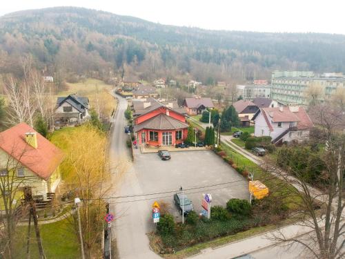 a view of a residential neighborhood with a house at Hotel Krak in Myślenice