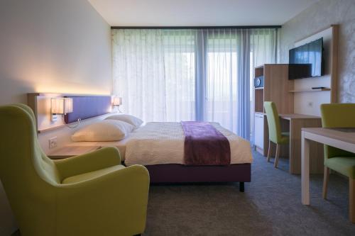 Ένα ή περισσότερα κρεβάτια σε δωμάτιο στο wohnMOTEL - Hinterforst