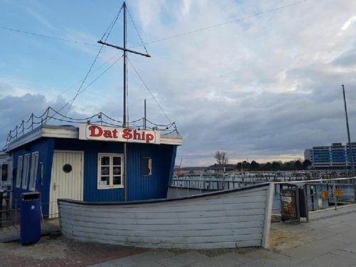 a small boat with a donut shop sign on it at Ferienhaus Familie Mischkies in Damp