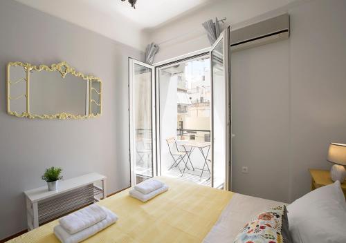 A bed or beds in a room at Attractive Flat near the Acropolis Museum & Metro Station by Athenian Homes