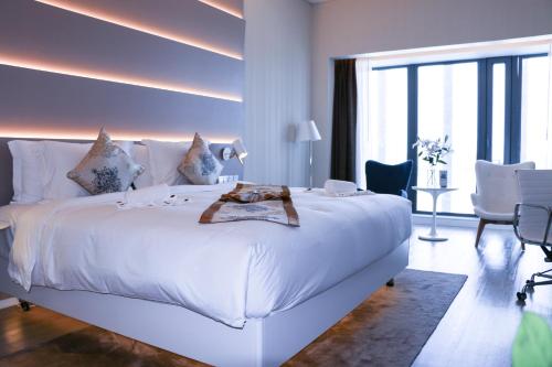 Postel nebo postele na pokoji v ubytování Sanya Phoenix Airport Hotel