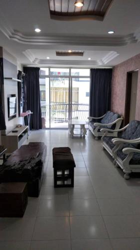 a hospital room with several beds and a table at Rose Apartment Kea Farm in Cameron Highlands