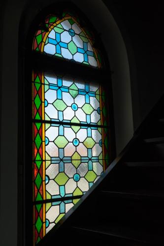 a colorful stained glass window in a stair case at Projekt GASTRAUM in Illertissen