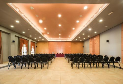 a large room with chairs and a stage in it at Be Live Collection Saïdia in Saidia 