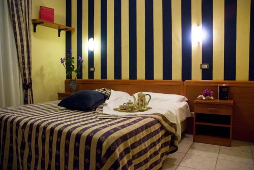 Posteľ alebo postele v izbe v ubytovaní Hotel Ristorante Umbria