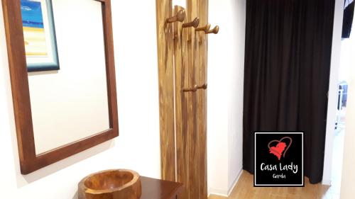 a door with a sign that says cozy living center at Casa Lady in Garda
