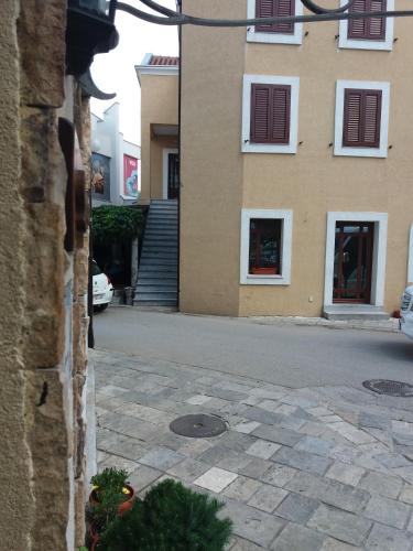 a view of a street with a building at Apartment Biba in Virpazar