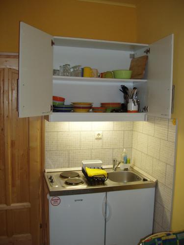 a kitchen with a sink and a counter top at Franciska Portája in Igal
