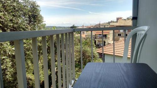 a balcony with a table and a view of a city at Village House in Liapades