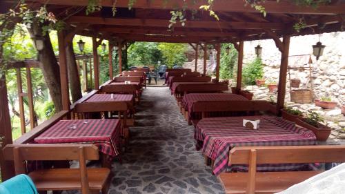 a row of tables with a cat sitting on top at Mario Complex in Melnik
