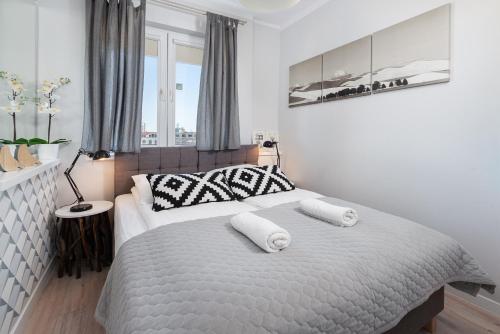 Кровать или кровати в номере Apartament ProBaltica II Gdynia