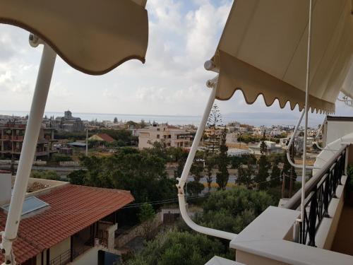 a view of a city from a balcony at Christi Apartments Α&Β in Kokkíni Khánion