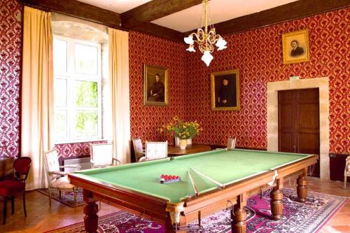 a living room with a pool table in it at Hôtel Château de Cavanac in Carcassonne