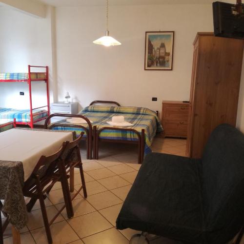 Ένα ή περισσότερα κρεβάτια σε δωμάτιο στο Appartamenti Angelo e Maria