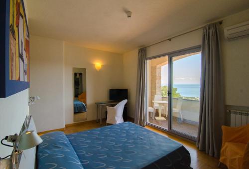 Postel nebo postele na pokoji v ubytování Hotel Arenella