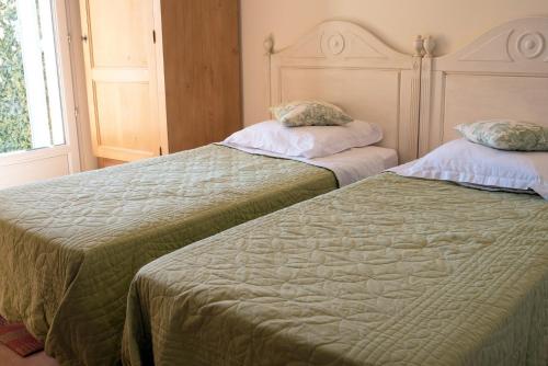 Un ou plusieurs lits dans un hébergement de l'établissement Le Claux du Puits by Ateya Vacances