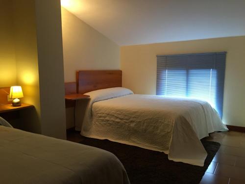 Katil atau katil-katil dalam bilik di B&B Yeguada La Parrilla