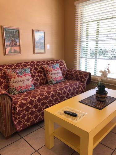 a living room with a couch and a coffee table at Lakeside Inn and Cafe in Saint Cloud