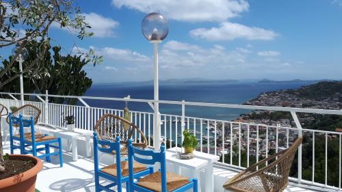 a dining room with a balcony overlooking the ocean at Paradise Relais Villa Janto' in Ischia