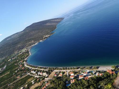 an aerial view of a beach and the ocean at marilena in Néa Epídhavros