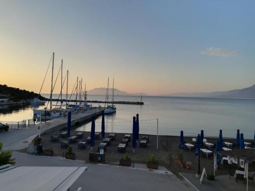 a dock with a bunch of boats in the water at marilena in Néa Epídhavros