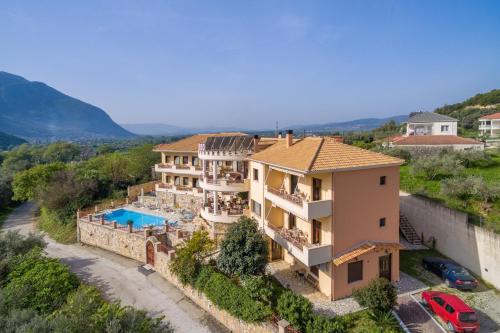 an aerial view of a house with a swimming pool at Hotel Eirini in Gliki