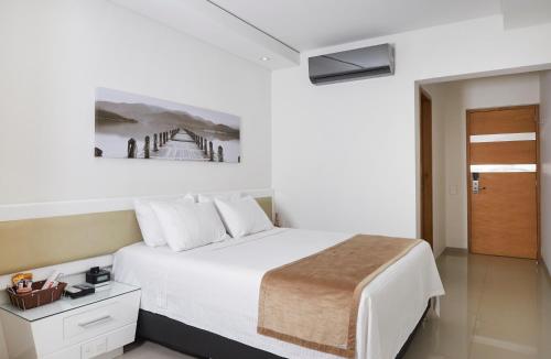 Säng eller sängar i ett rum på Hotel Zona A