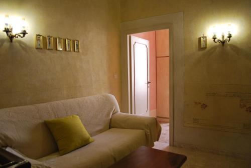 a living room with a couch and a door at Casa S.Maria in Levane