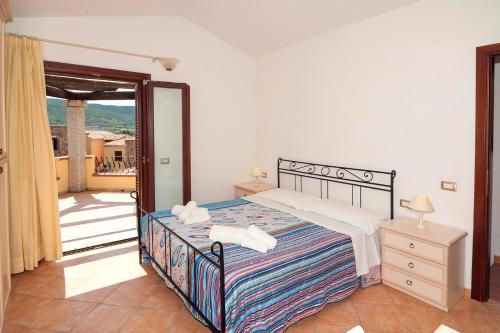 A bed or beds in a room at Li Troni