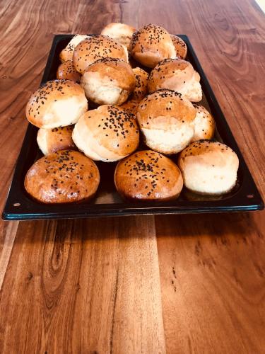 a tray of bagels on a wooden table at JEZ&SPI Plánice in Plánice