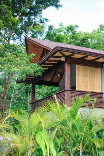 a building in the middle of some trees at Lua Villas in Santa Teresa Beach